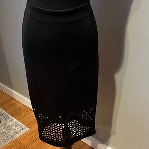 Elegant Black Midi Skirt with Cutout Hem